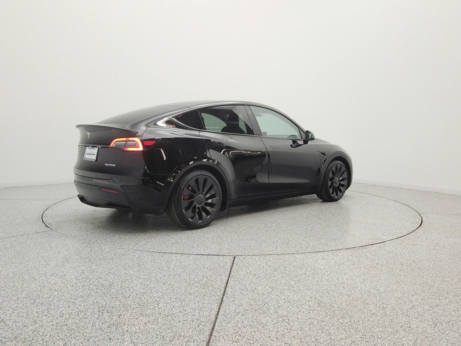 Used 2022 Solid Black Tesla Performance AWD image 5