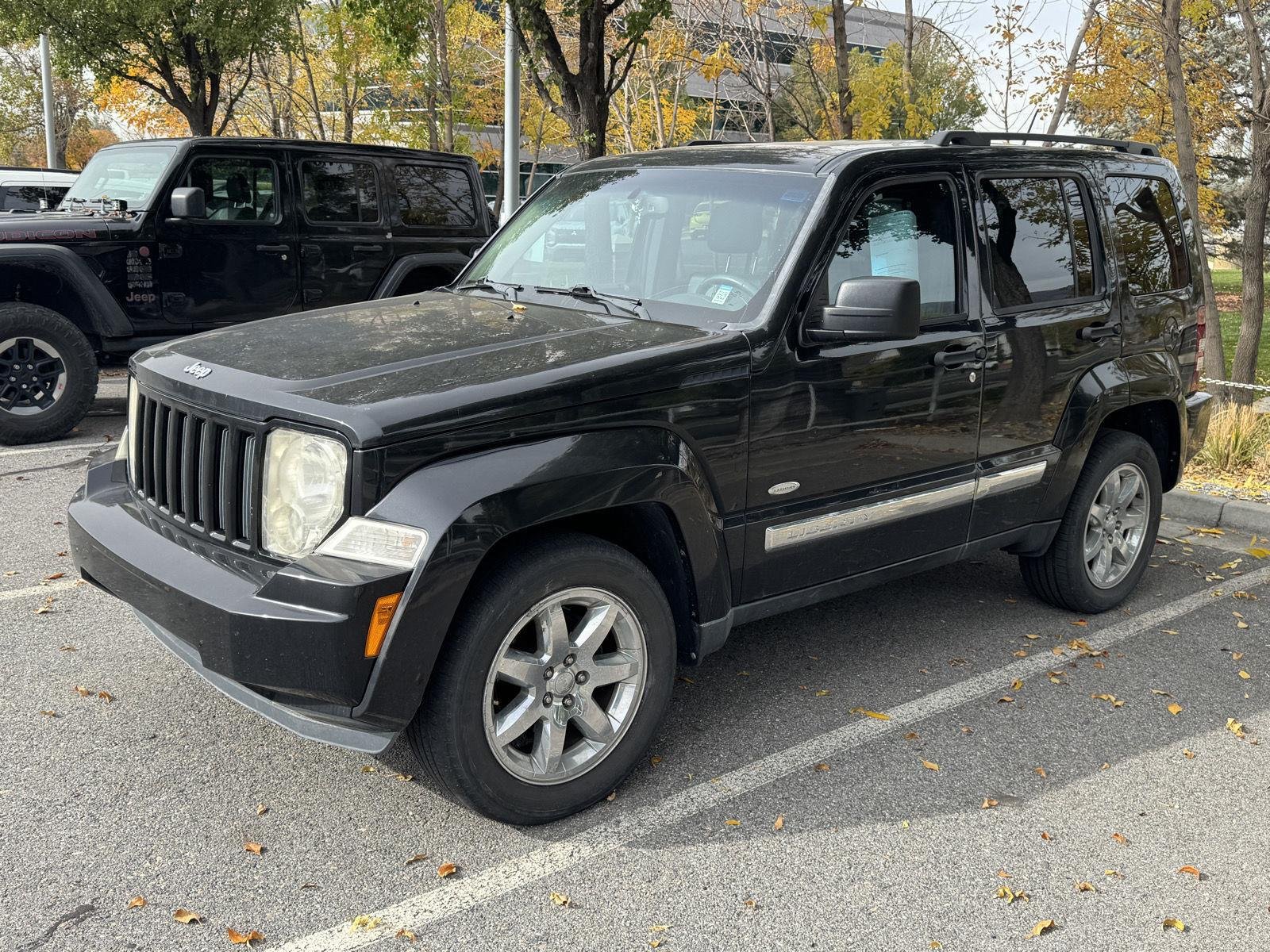 Used 2012 Brilliant Black Crystal Pearl Jeep Sport Latitude image 1