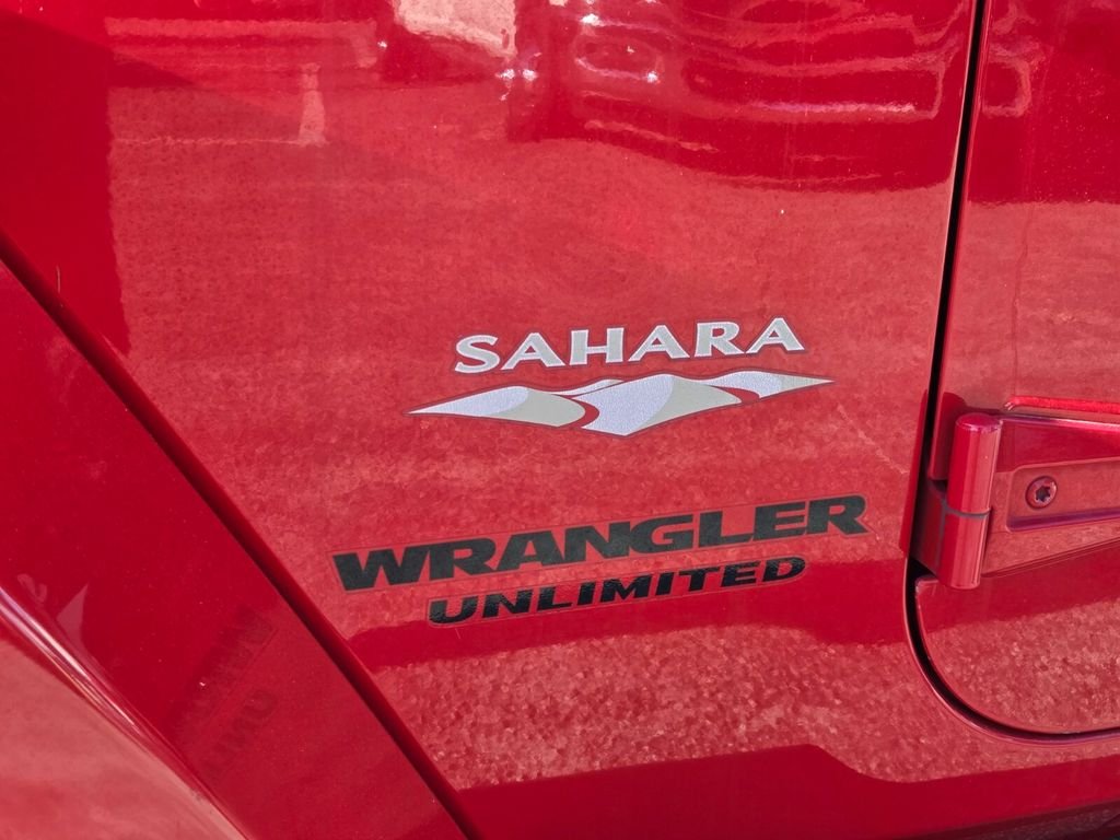 Used 2015 Red Jeep Unlimited Sahara image 9