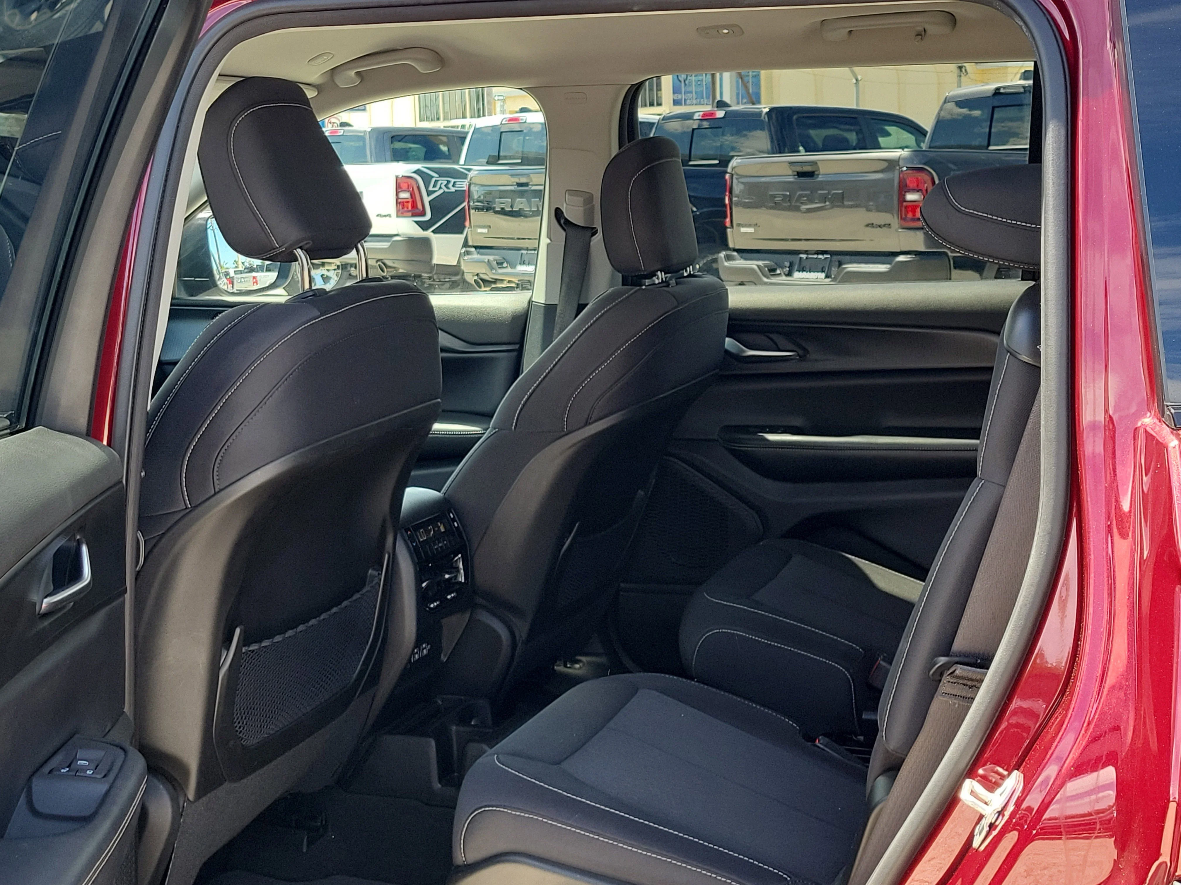 Used 2023 Velvet Red Pearlcoat Jeep Laredo image 15