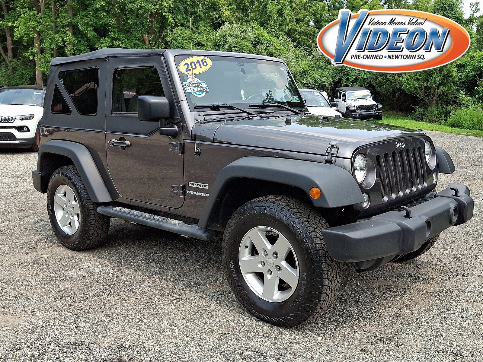 Used 2016 Granite Crystal Metallic Clearcoat Jeep Sport image 1