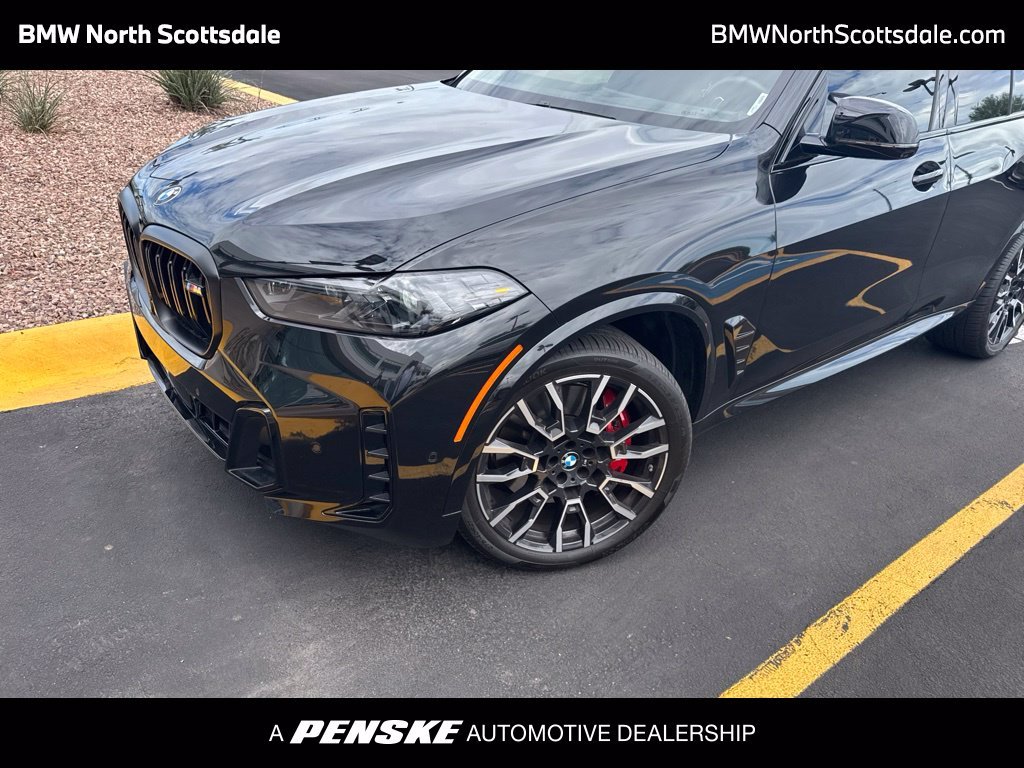 Certified Used 2026 Black Sapphire Metallic BMW M60i image 1