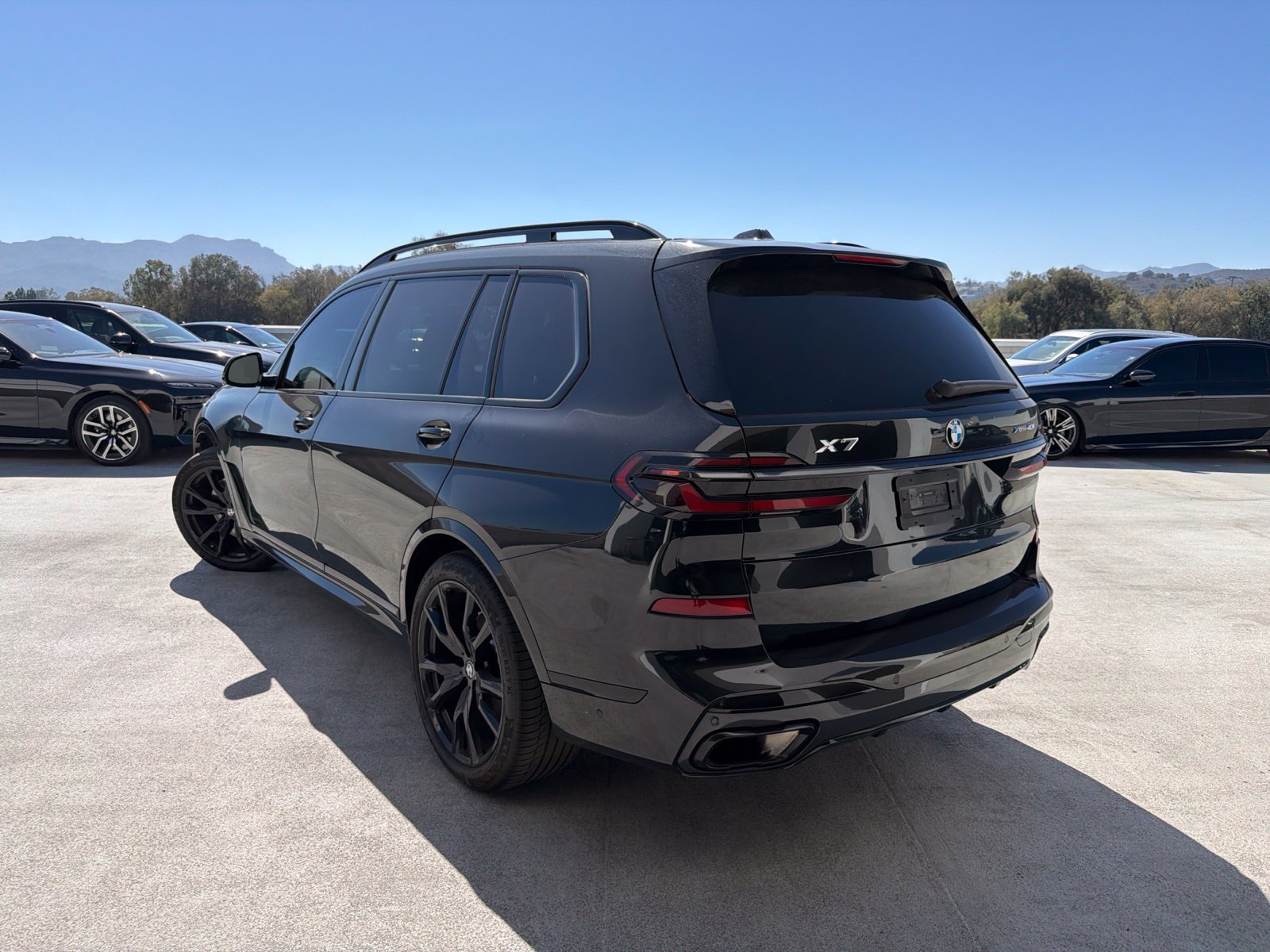 Certified Used 2026 Black Sapphire Metallic BMW xDrive40i image 2