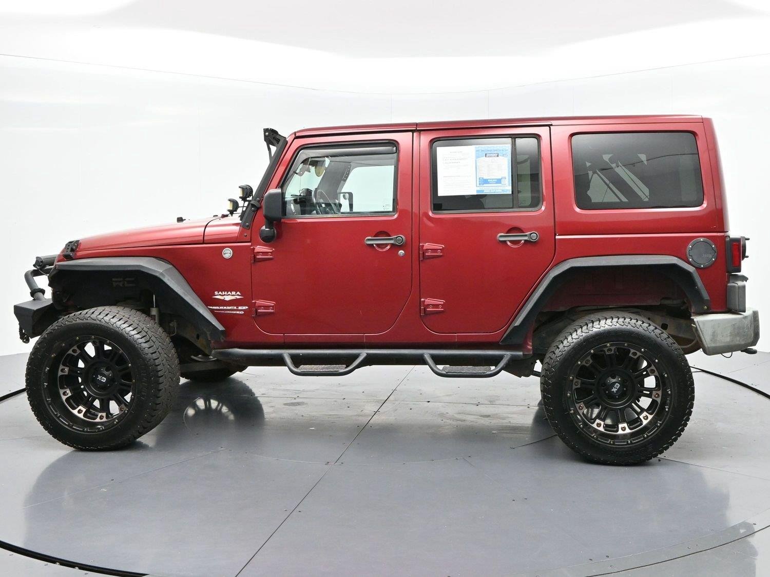 Used 2011 Deep Cherry Red Crystal Pearlcoat Jeep Sahara image 4