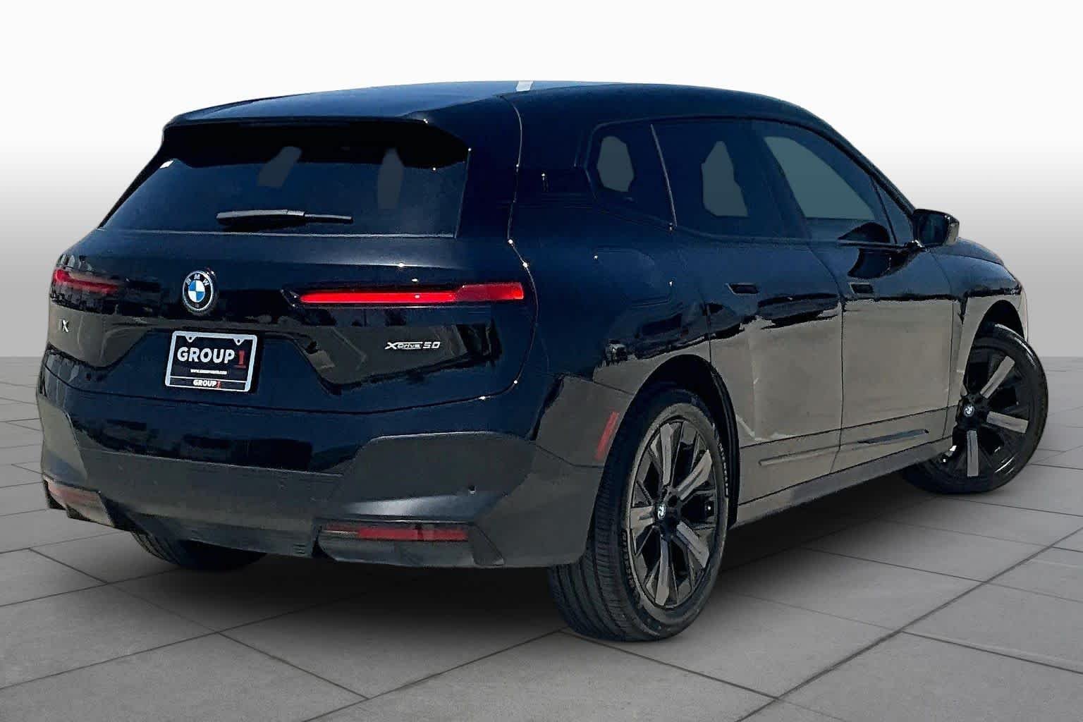 Used 2024 Black Sapphire Metallic BMW xDrive50 image 12