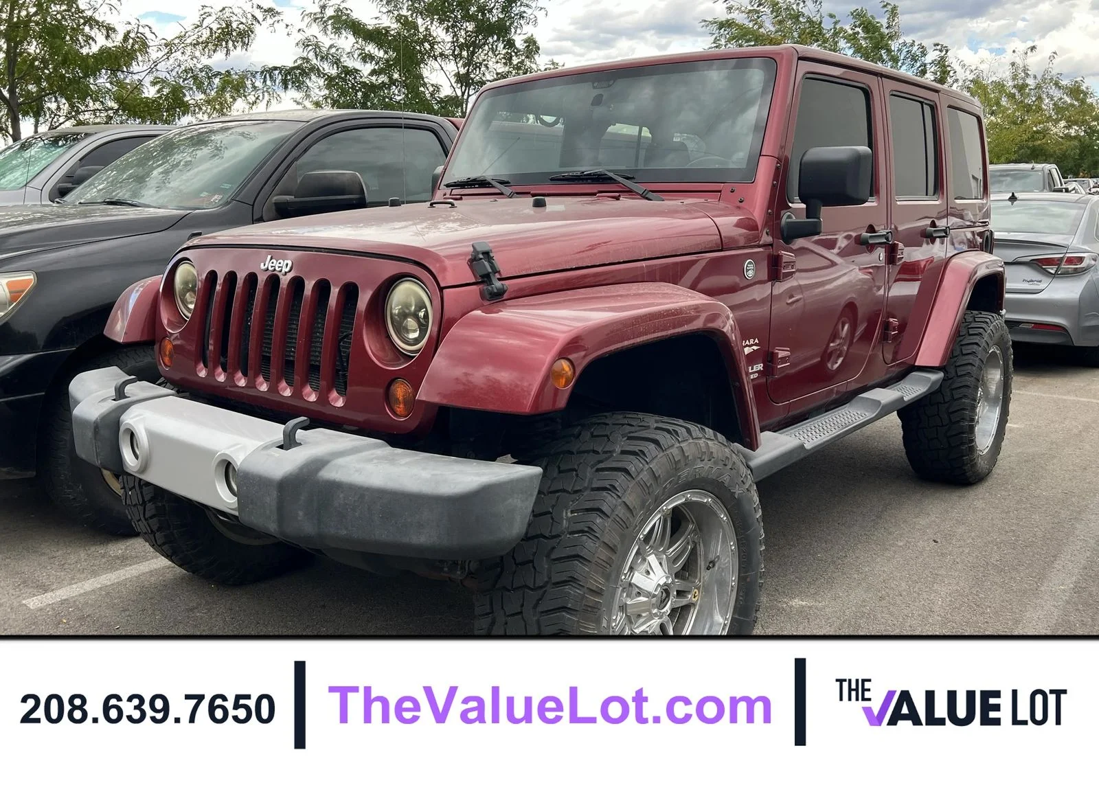Used 2012 Red Jeep Unlimited Sahara image 1