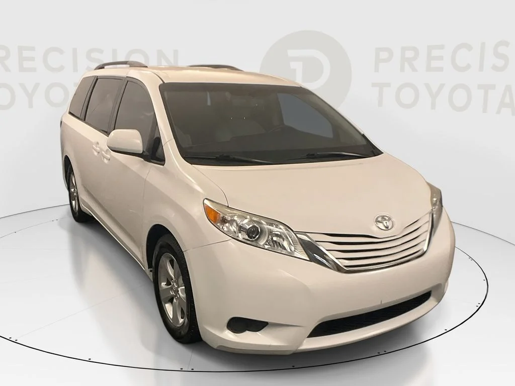Used 2015 Super White Toyota LE image 1