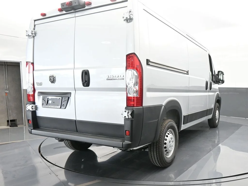 Used 2025 Bright Silver Clearcoat Metallic Ram Low Roof image 5