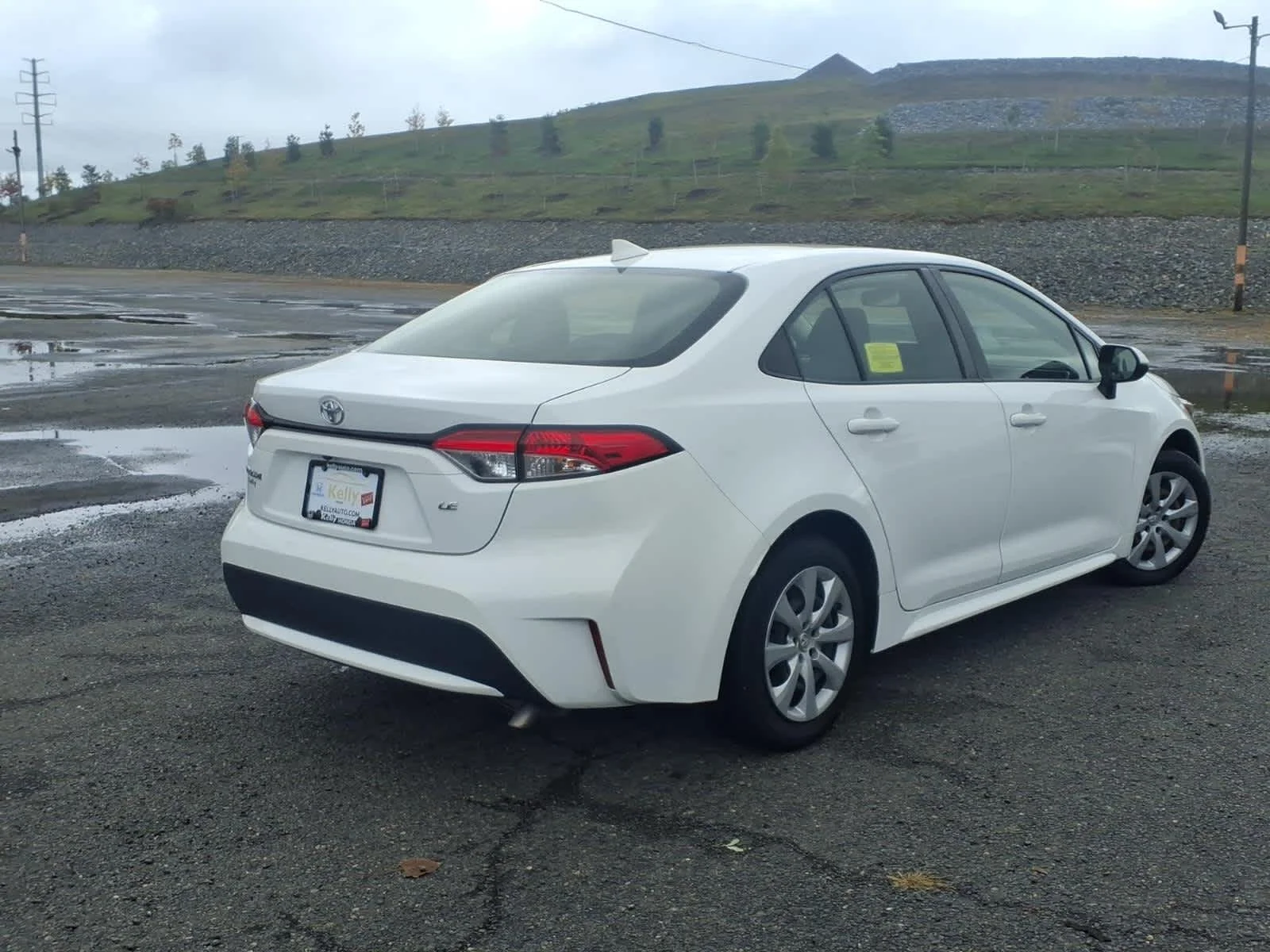 Used 2021 Super White Toyota LE image 5