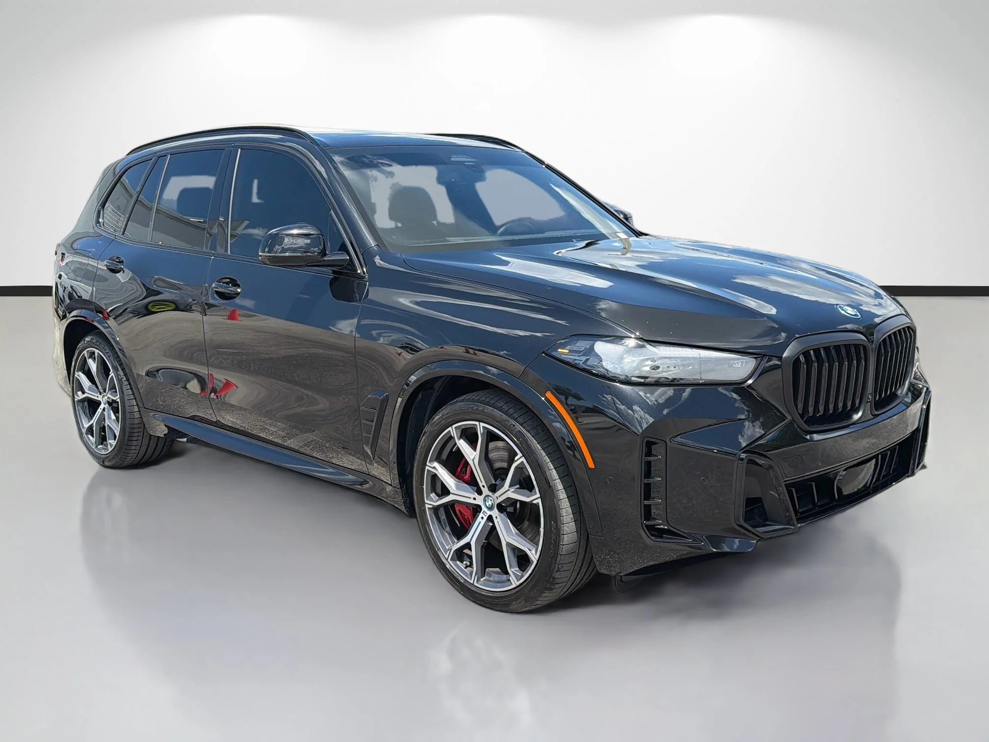 Used 2025 Black Sapphire Metallic BMW xDrive50e image 1