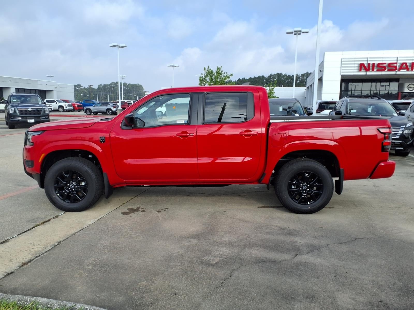 2026 Nissan Frontier SV Red at Robbins Nissan