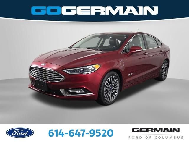 Certified Used 2017 Ruby Red Metallic Ford Titanium image 1