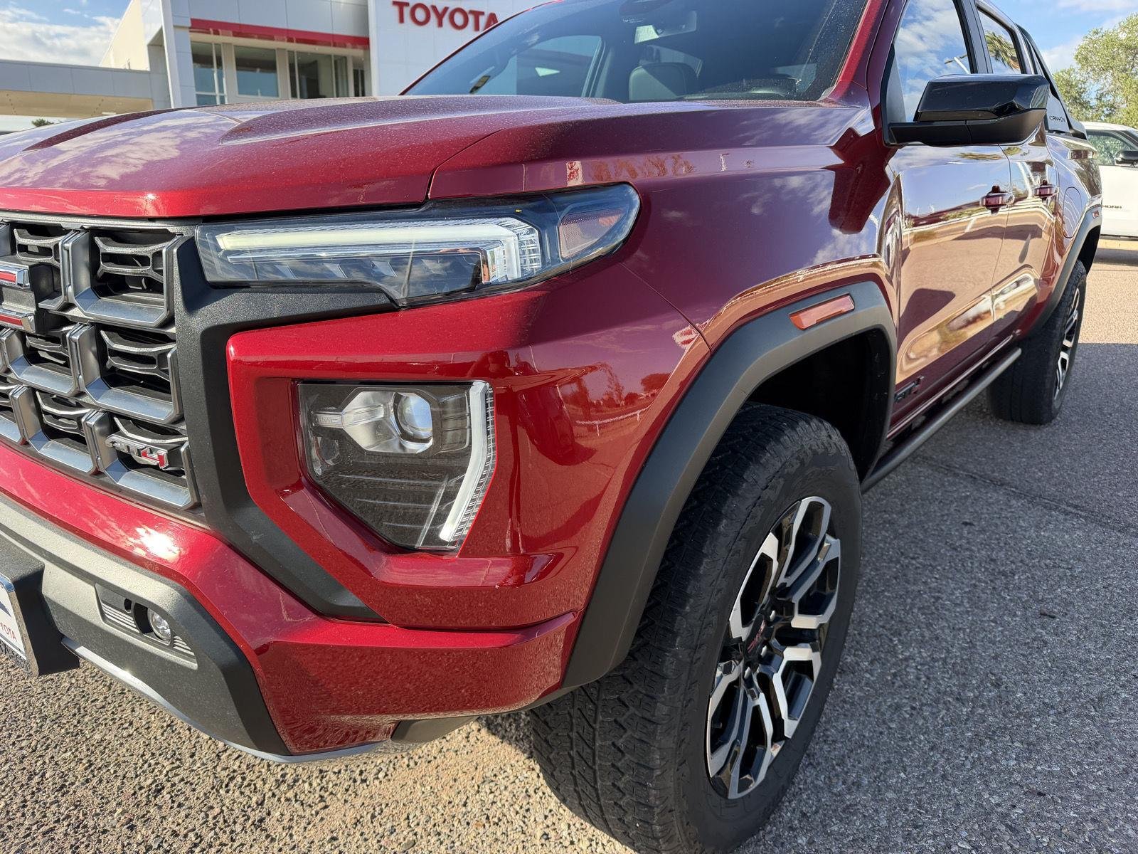 Used 2025 Volcanic Red Tintcoat GMC 4WD AT4 image 11