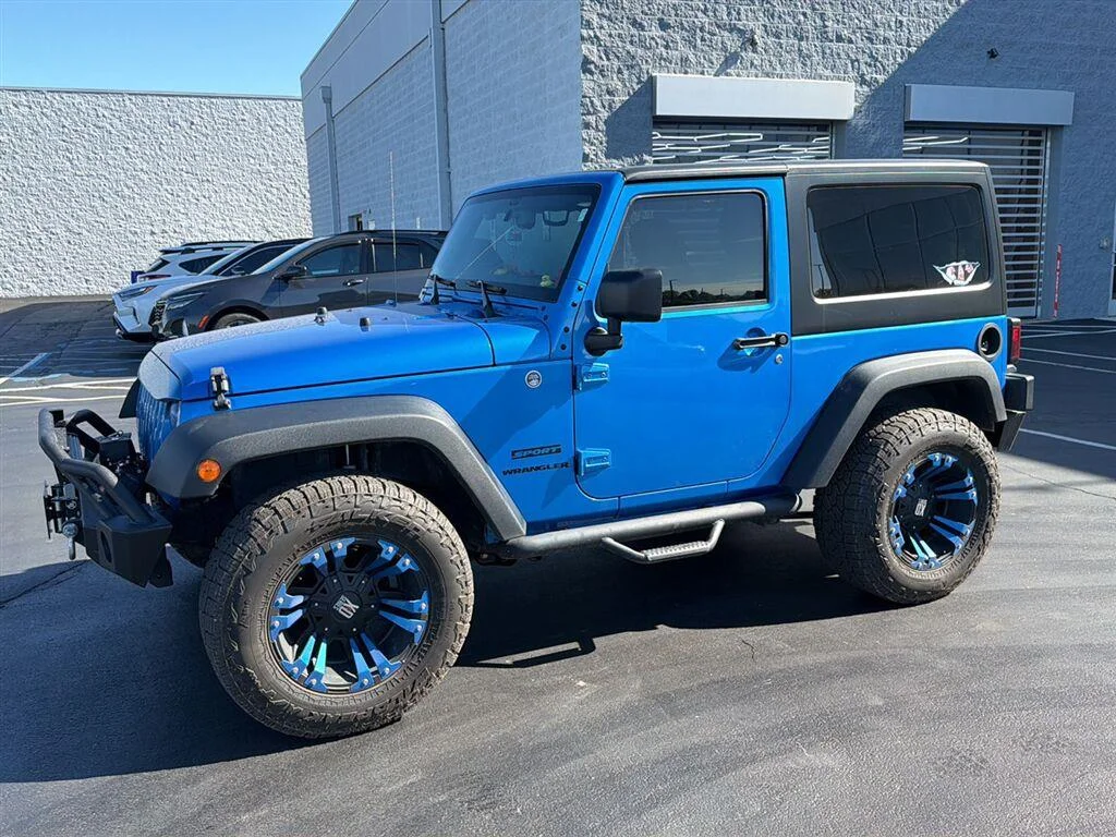 Used 2015 Hydro Blue Pearl Coat Jeep Sport image 4