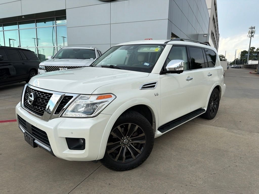Used 2019 Pearl White Nissan Platinum image 1