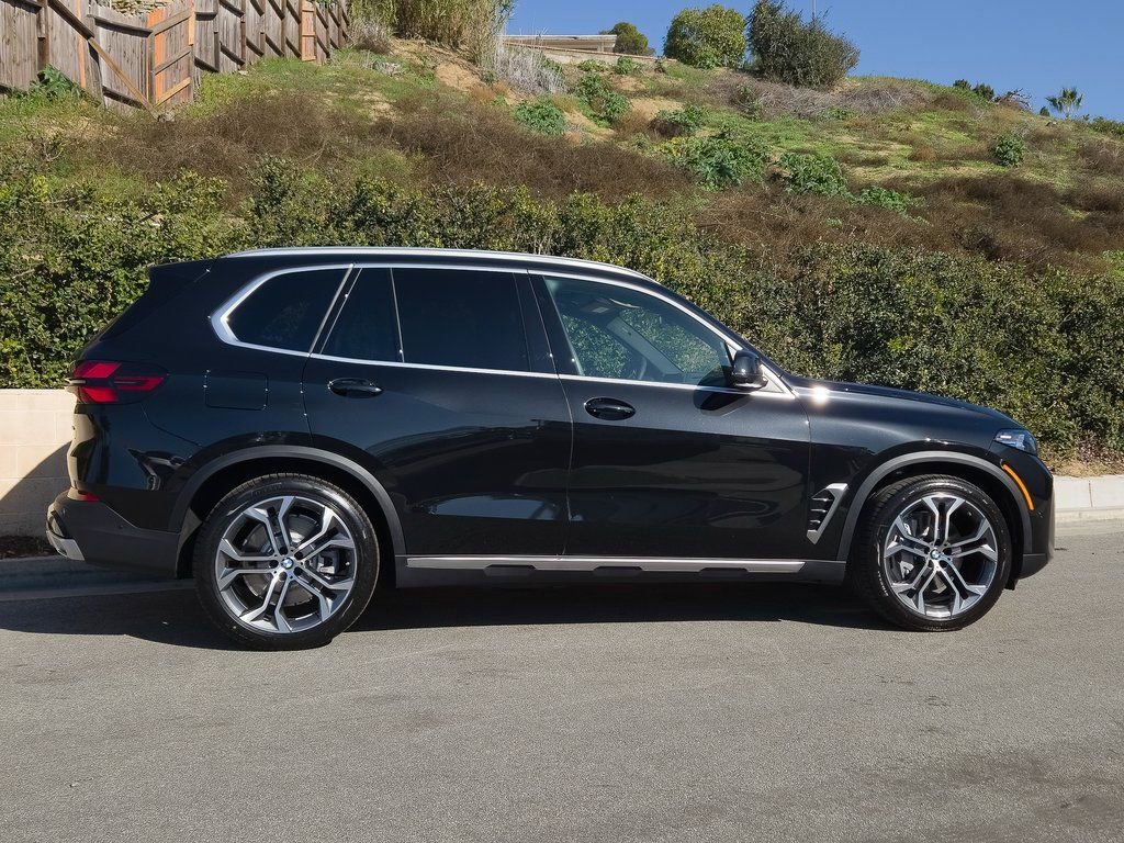 New 2026 Black Sapphire Metallic BMW xDrive50e image 4