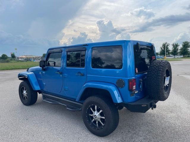 Used 2015 Blue Jeep Unlimited Sahara image 4