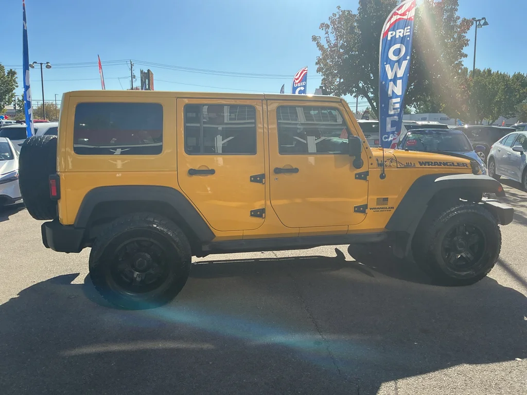 Used 2015 Baja Yellow Jeep Sport image 4