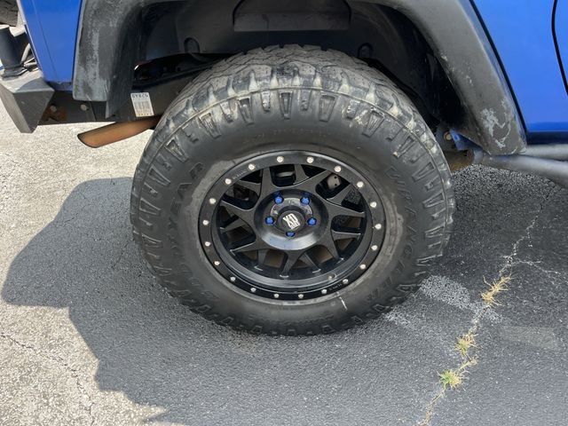 Used 2014 Flame Red Clearcoat Jeep Sport image 9