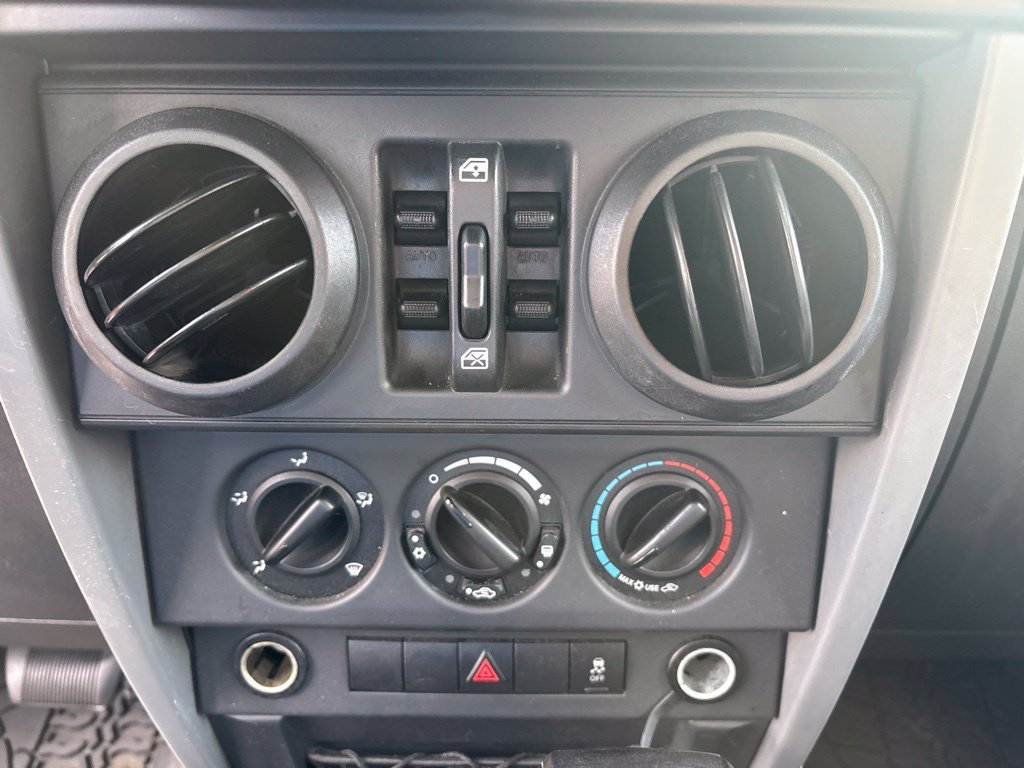 Used 2010 Orange Jeep Unlimited Sport image 14