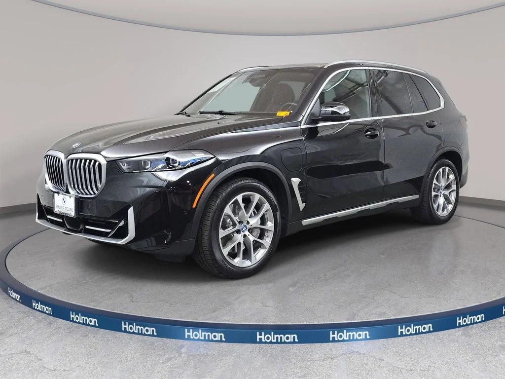 Used 2025 Black Sapphire Metallic BMW xDrive50e image 1