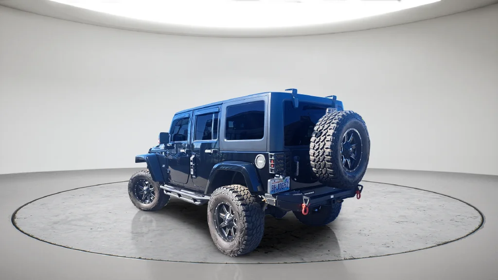 Used 2015 Black Jeep Unlimited Sahara image 6