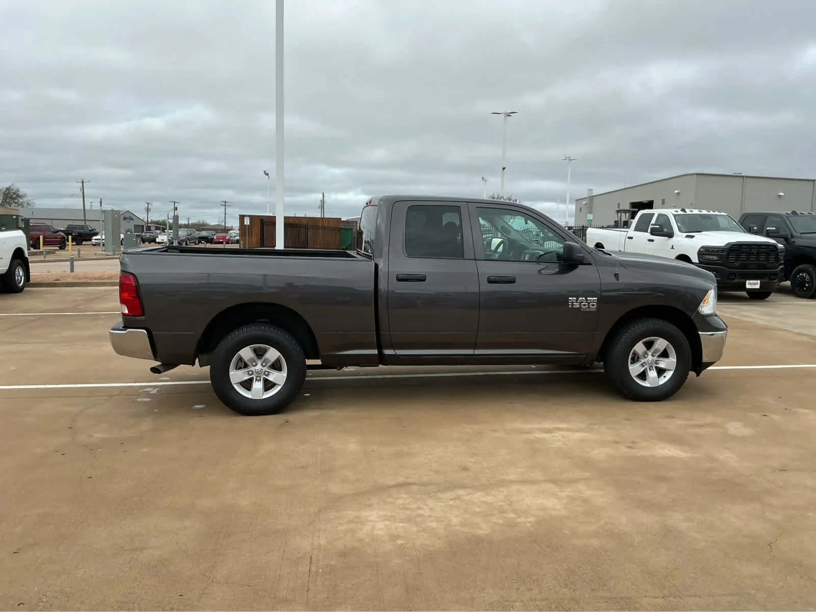 Used 2024 Granite Crystal Metallic Clearcoat Ram SLT image 5