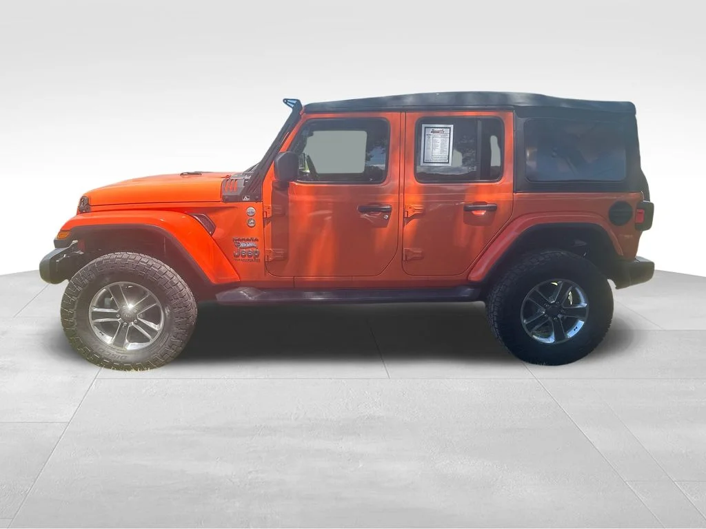 Used 2018 Orange Jeep Unlimited Sahara image 8