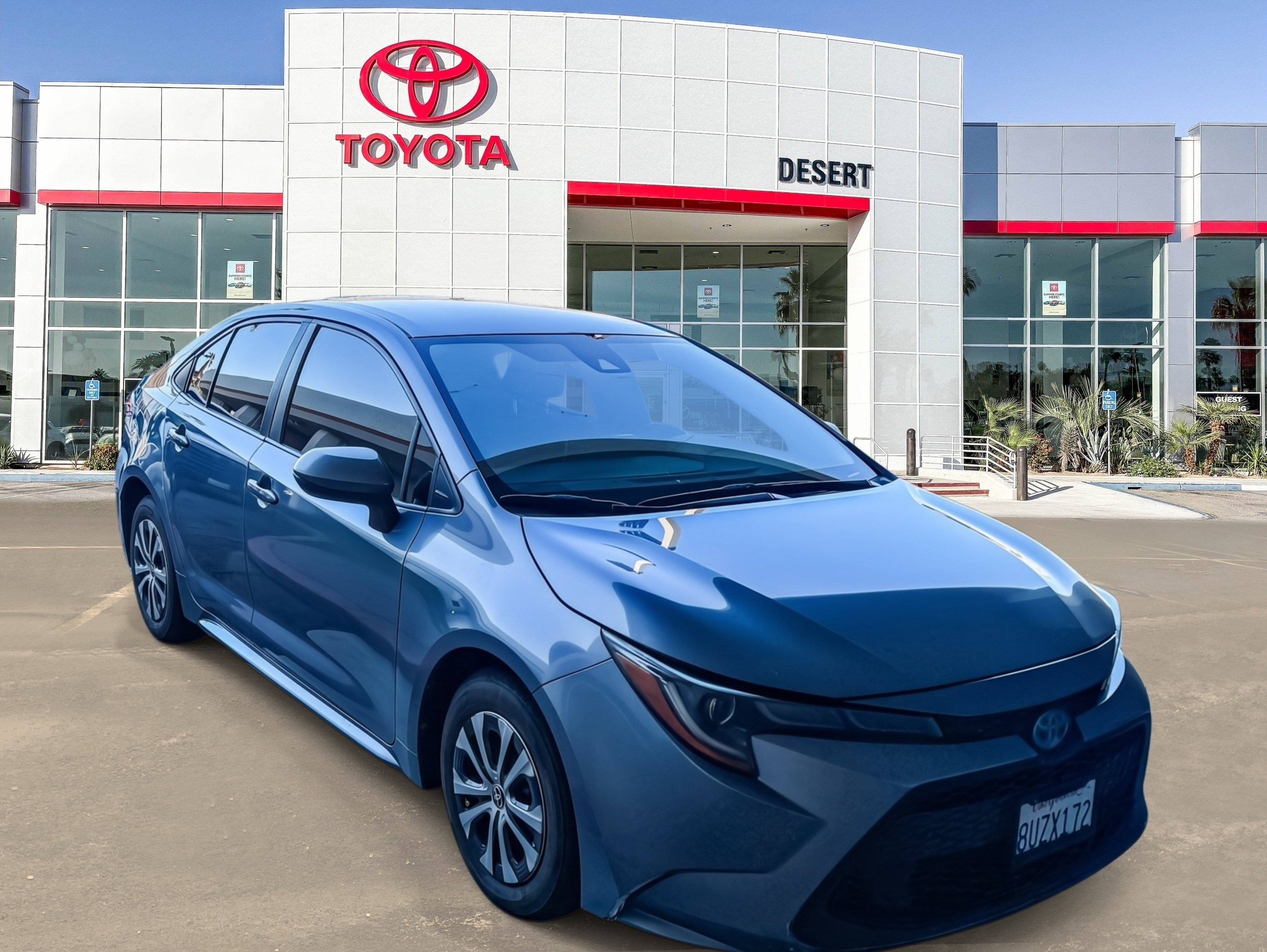 Used 2021 Super White Toyota Hybrid LE image 1