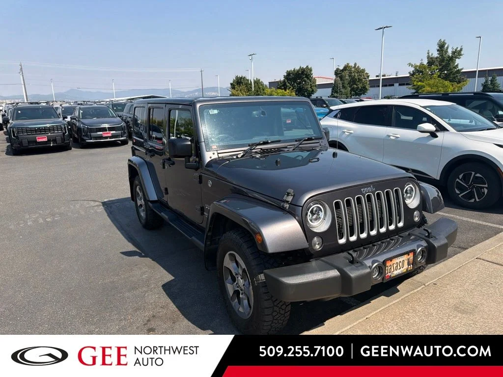 Used 2016 Gray Jeep Unlimited Sahara image 1