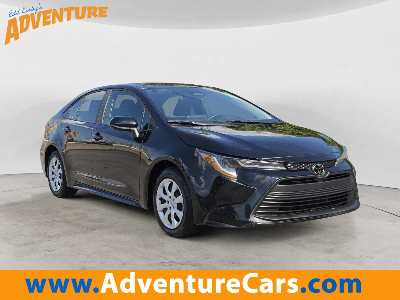 Used 2024 Midnight Black Metallic Toyota LE image 1