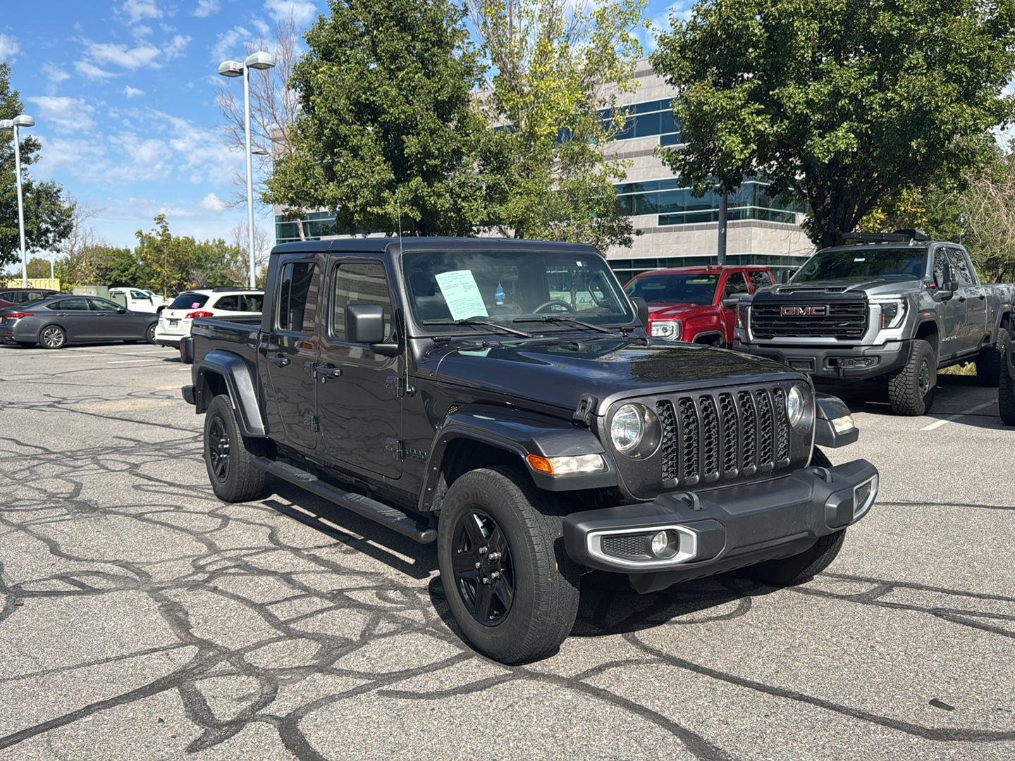 Used 2021 Granite Crystal Metallic Clearcoat Jeep Sport S image 1