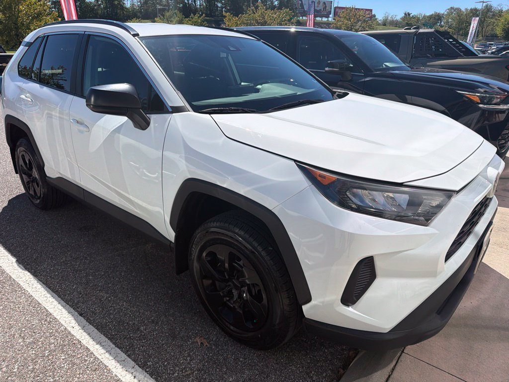Used 2021 White Toyota LE image 1