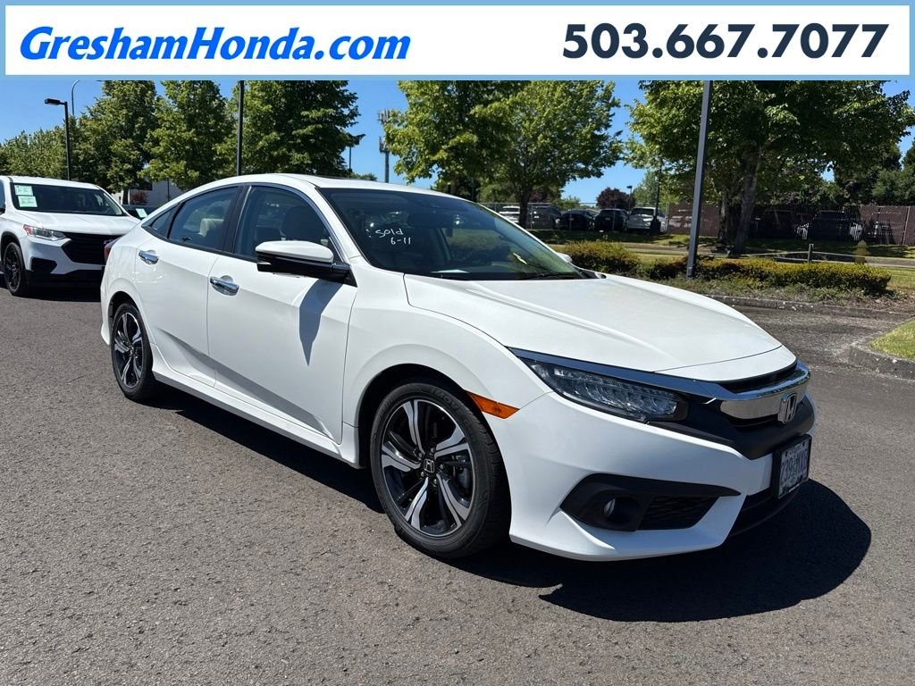 Used 2016 White Orchid Pearl Honda Touring image 1
