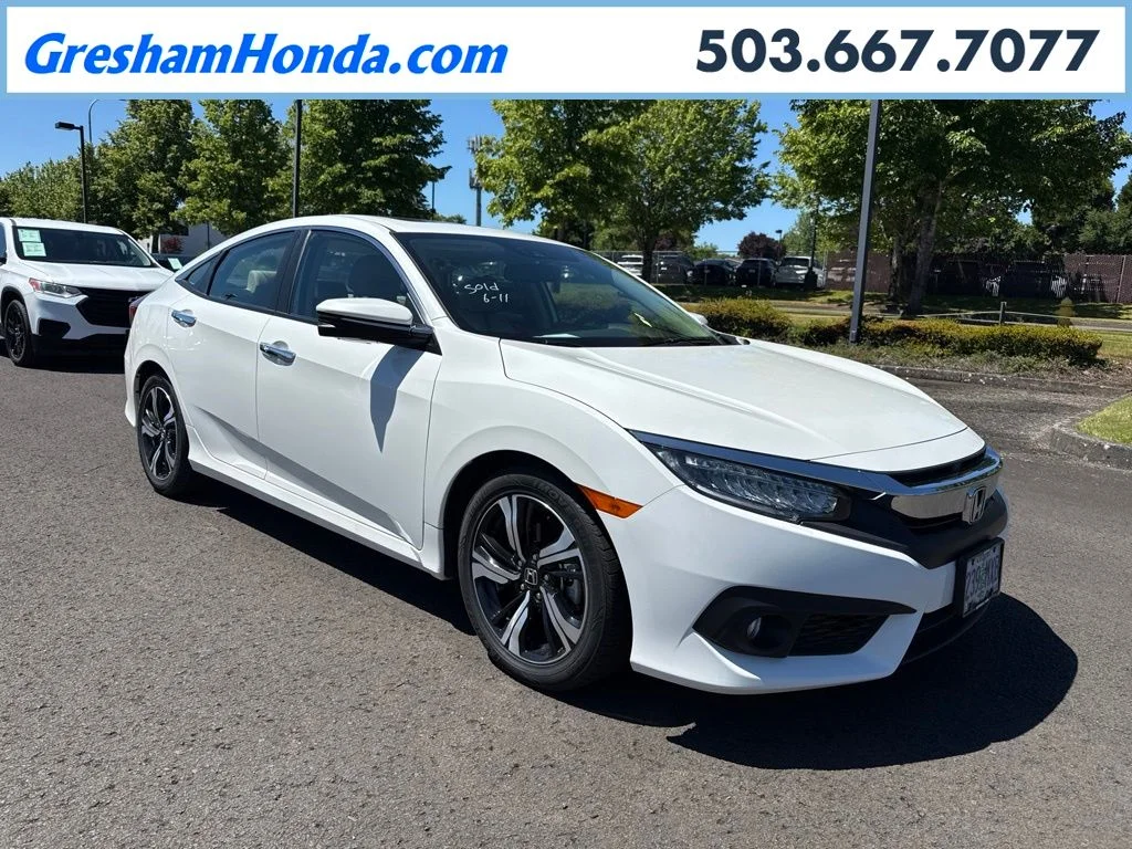 Used 2016 White Orchid Pearl Honda Touring image 1