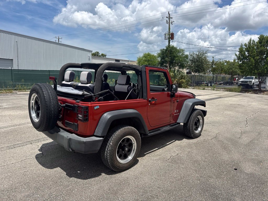 Used 2009 Sunburst Orange Pearl Jeep X image 4