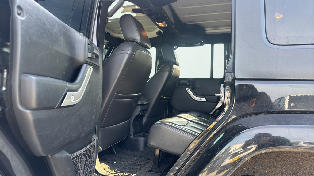 Used 2015 Black Jeep Unlimited Sahara image 14