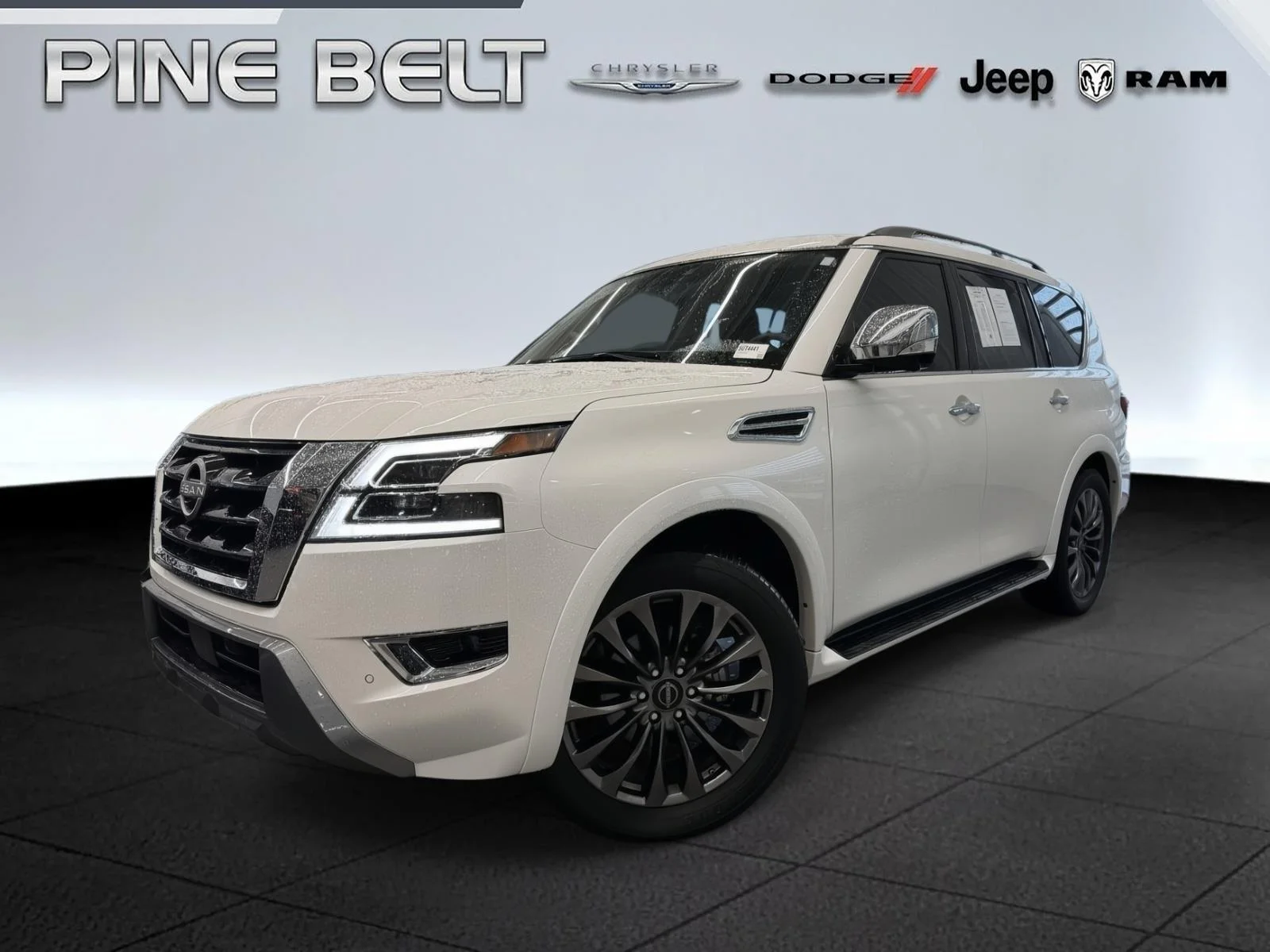 Used 2024 Aspen White Tricoat Nissan Platinum image 1