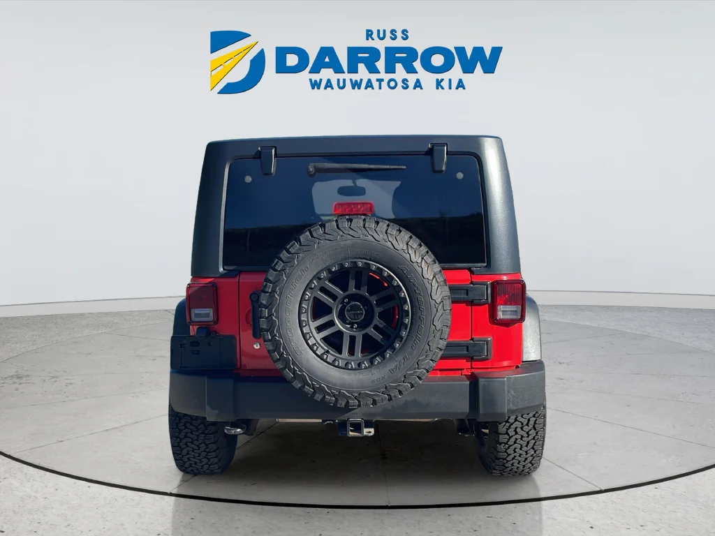 Used 2013 Red Jeep Unlimited Sport image 4