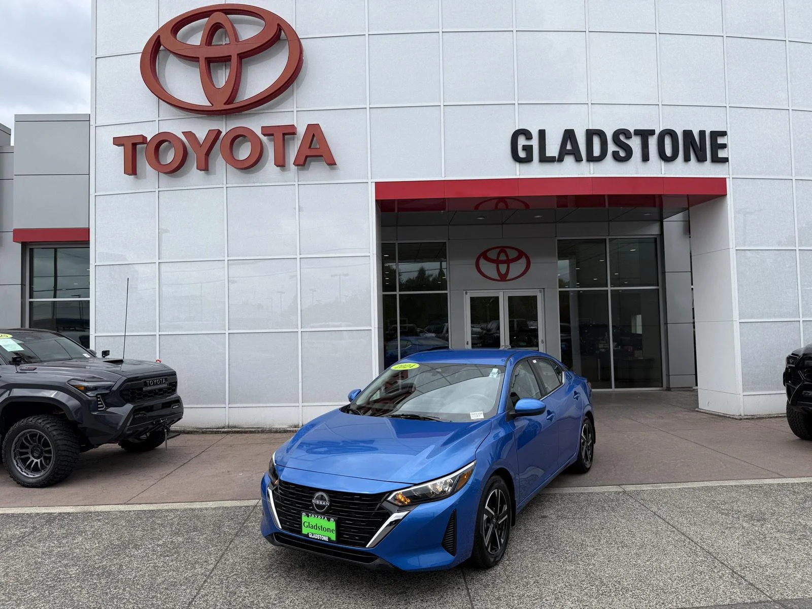 Used 2024 Electric Blue Metallic Nissan SV image 1