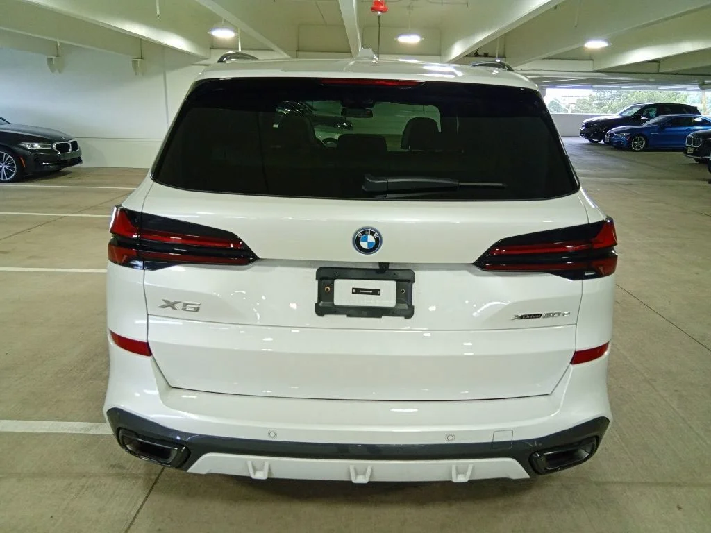 Used 2025 Mineral White Metallic BMW xDrive50e image 6