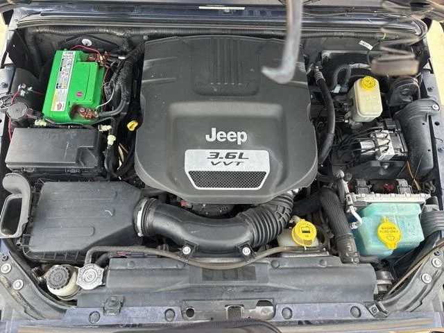 Used 2013 Blue Jeep Unlimited Sport image 10