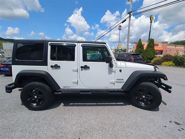 Used 2016 White Jeep Unlimited Sport image 4