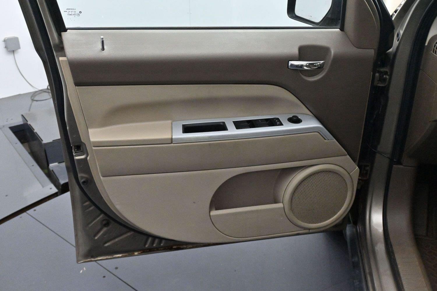 Used 2008 Light Khaki Metallic Jeep Sport image 10