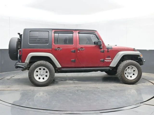 Used 2012 Red Jeep Unlimited Sport image 10