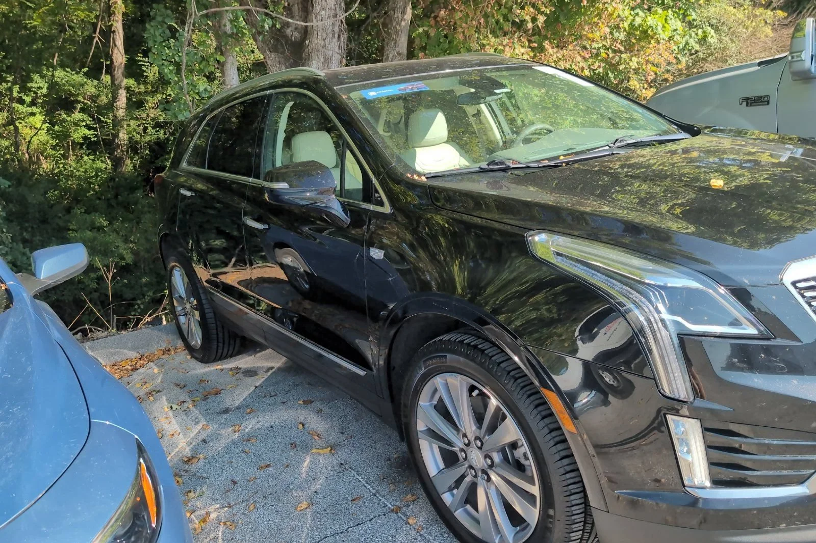 Used 2023 STELLAR BLACK METALLIC Cadillac FWD Premium Luxury image 2
