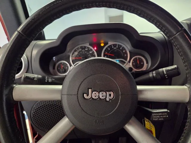 Used 2009 Orange Jeep Unlimited Sahara image 21