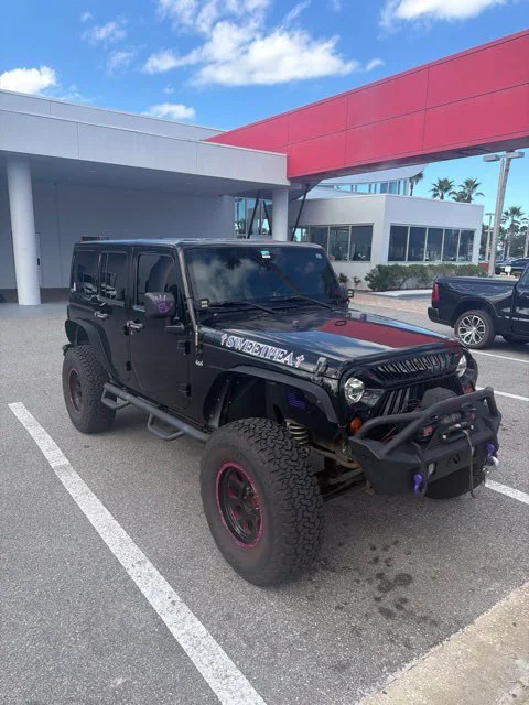 Used 2011 Black Jeep Unlimited Sport image 2
