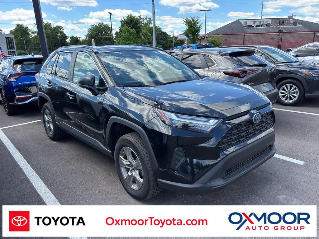 Used 2024 Midnight Black Metallic Toyota Hybrid LE image 1