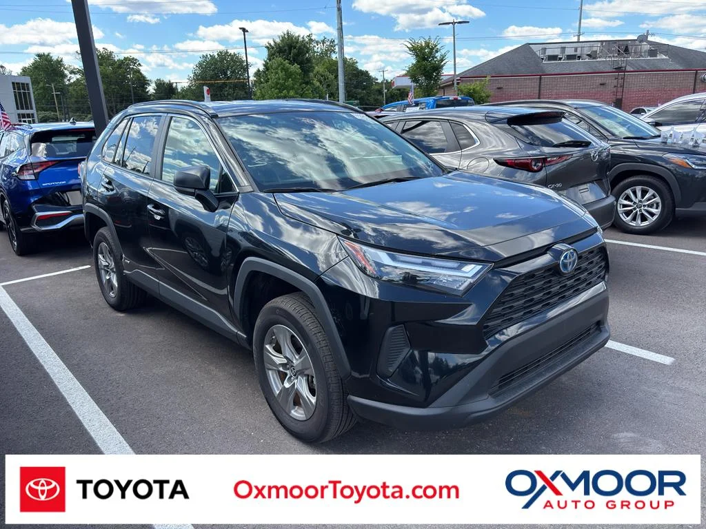 Used 2024 Midnight Black Metallic Toyota Hybrid LE image 1